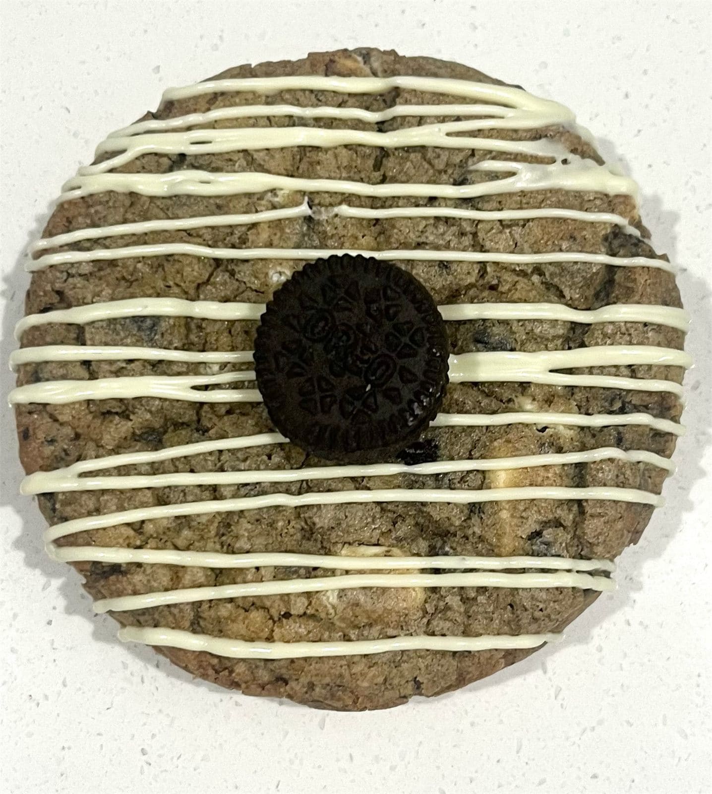 Oreo white choc cookie with white chocolate drizzle